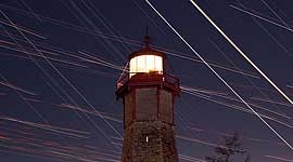 Venus and Jupiter conjunction with star and aircraft trails, Gibraltar Lighthouse, Toronto Islands