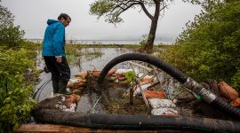Inspecting pump intake hose, Ward's Island, Toronto Islands