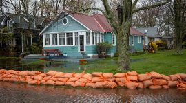 Floodwaters and sandbags in front of 3 Seneca Ave, Algonquin Island, Toronto Islands