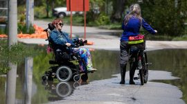 Talking in the floodwaters on Cibola Ave, Flood of 2017, Algonquin Island, Toronto Islands